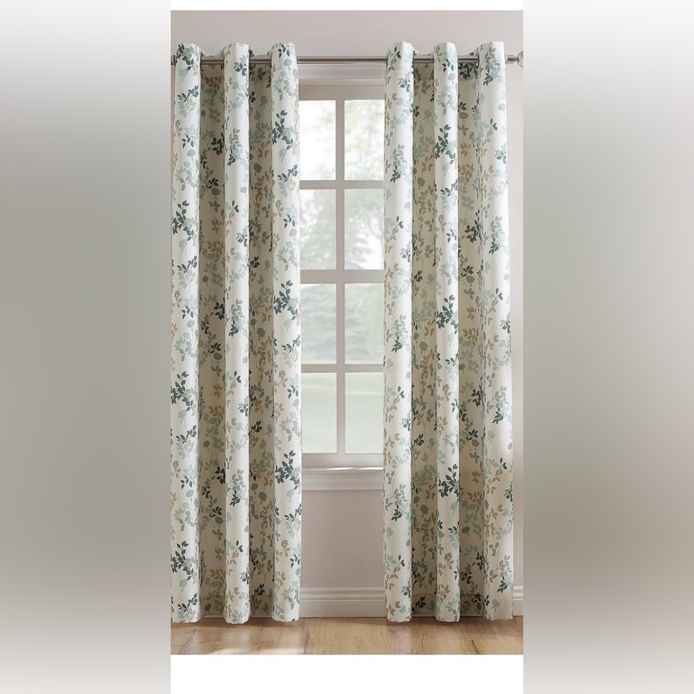 Light filtering 84Lx48w grommet drapes. Rings on drapes are bronze.